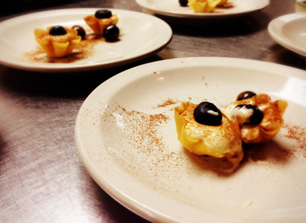 Fresh cream of mascarpone dusted with coco powder and blueberry
