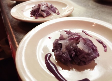 Blueberry sticky rice with sweetened reduced blueberry sauce. 