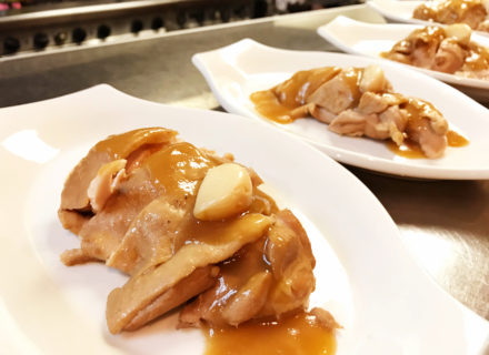chicken thigh meat slathered with reduced gravy and garlic